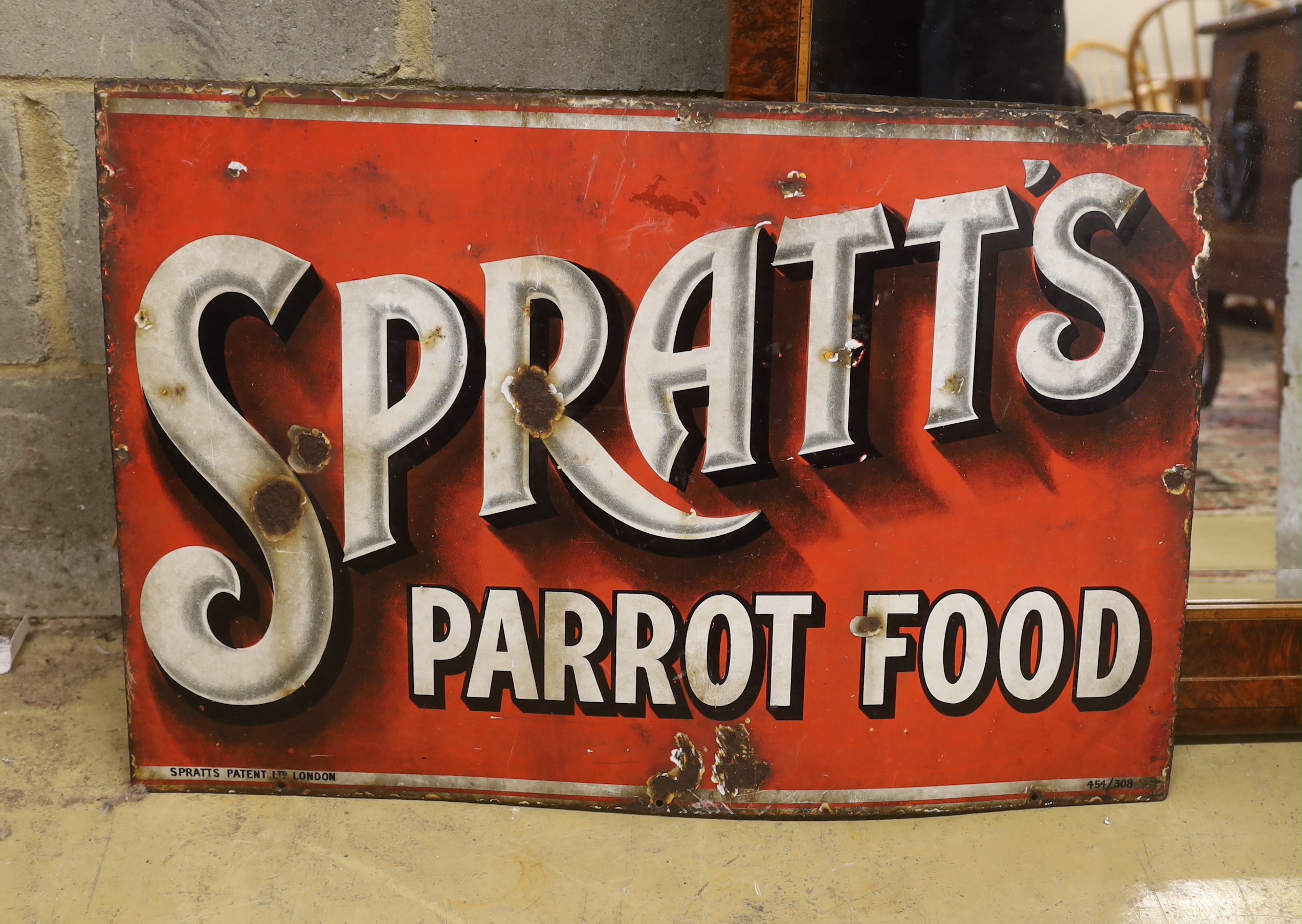 An original enamelled advertising sign 'Spratt's Parrott Food', width 77cm, height 51cm